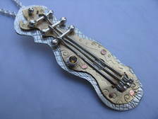 String Instrument with Faceted Citrine Pendant